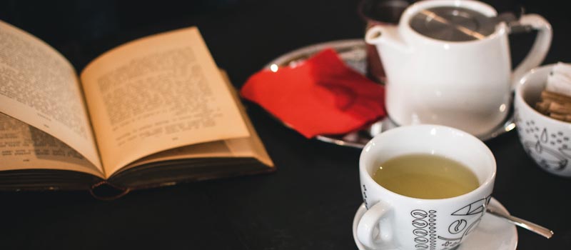 A cup of tea with a book
